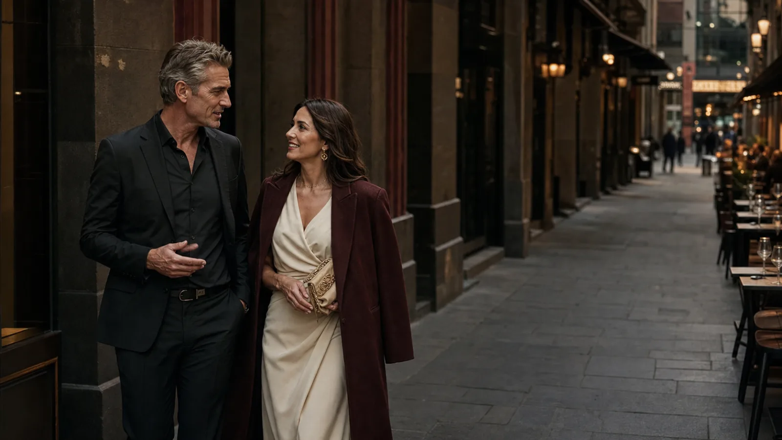 Adult couple talking while walking through a refined Melbourne laneway